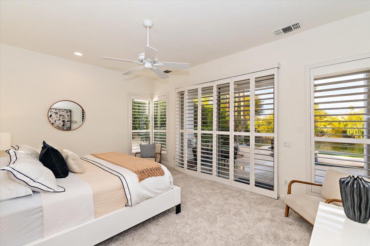 215 Loch Lomond Road Rancho Mirage, CA 92270 - Photo 20 of 57 a bedroom with bed and balcony