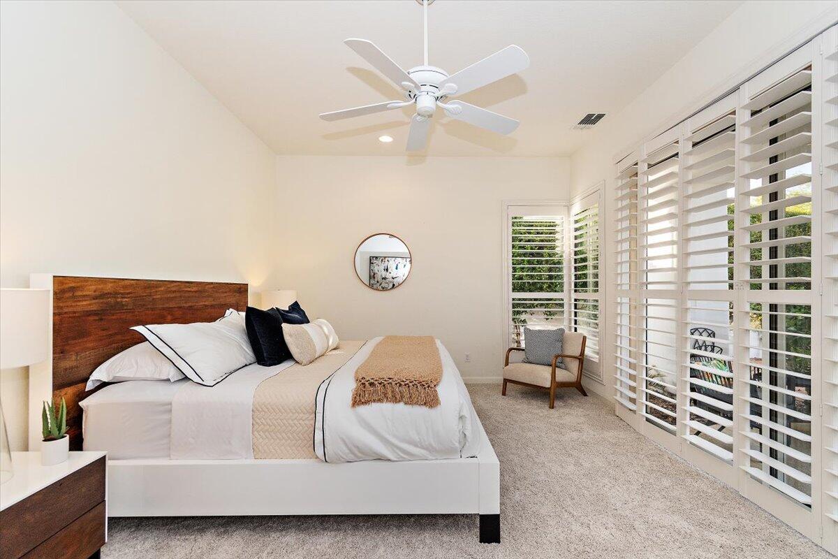 215 Loch Lomond Road Rancho Mirage, CA 92270 - Photo 21 of 57 a bedroom with a bed and window