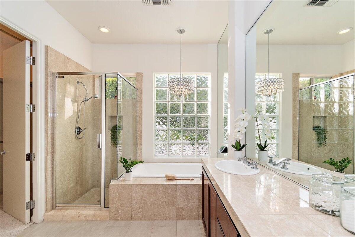 215 Loch Lomond Road Rancho Mirage, CA 92270 - Photo 23 of 57 a spacious bathroom with a granite countertop tub shower and sink