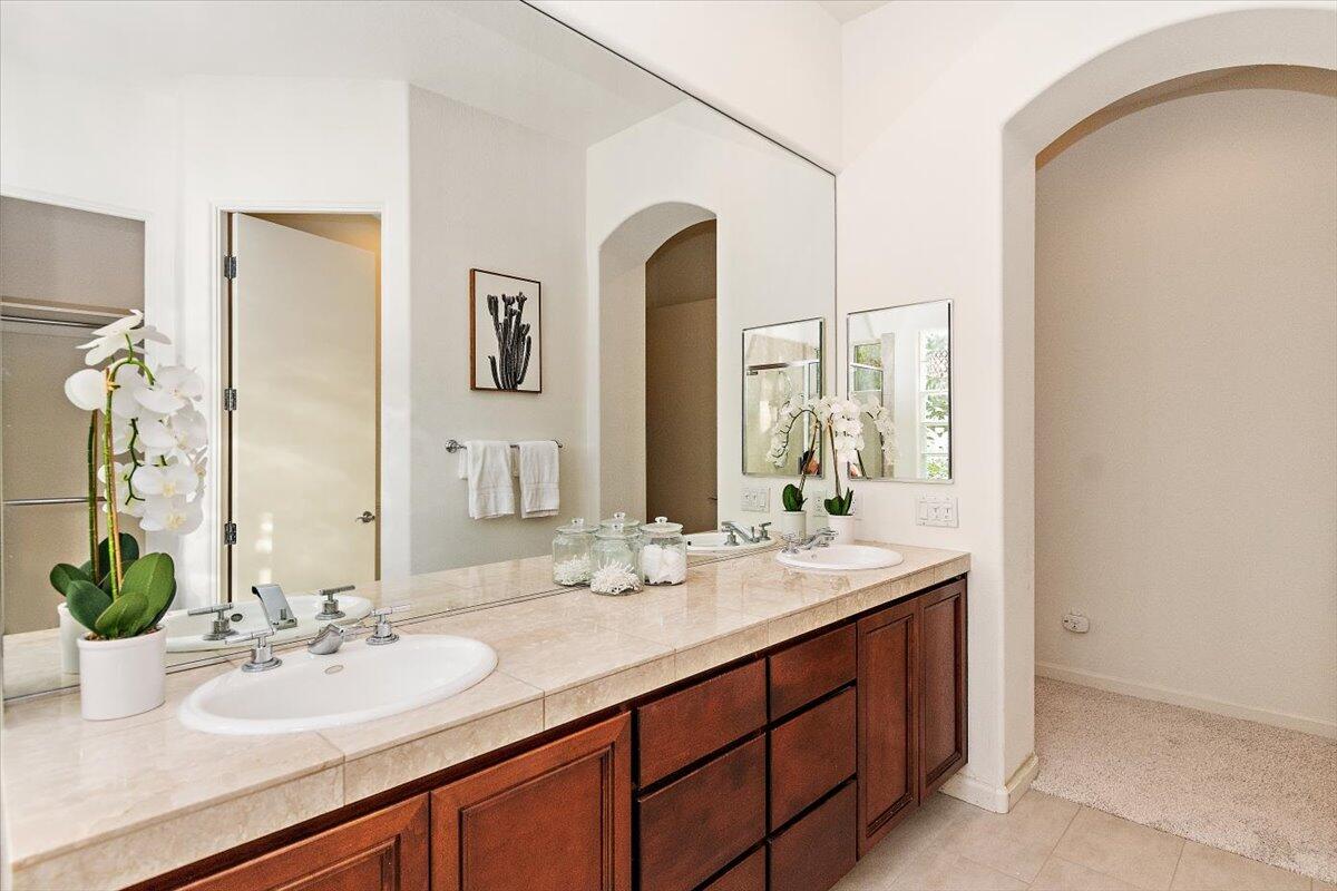 215 Loch Lomond Road Rancho Mirage, CA 92270 - Photo 24 of 57 a bathroom with a sink and a mirror