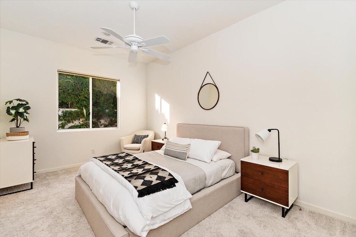215 Loch Lomond Road Rancho Mirage, CA 92270 - Photo 27 of 57 a bedroom with a bed and a window