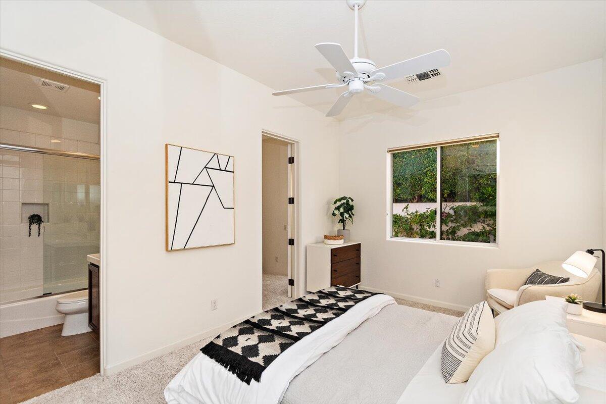 215 Loch Lomond Road Rancho Mirage, CA 92270 - Photo 28 of 57 a bedroom with a bed and a window