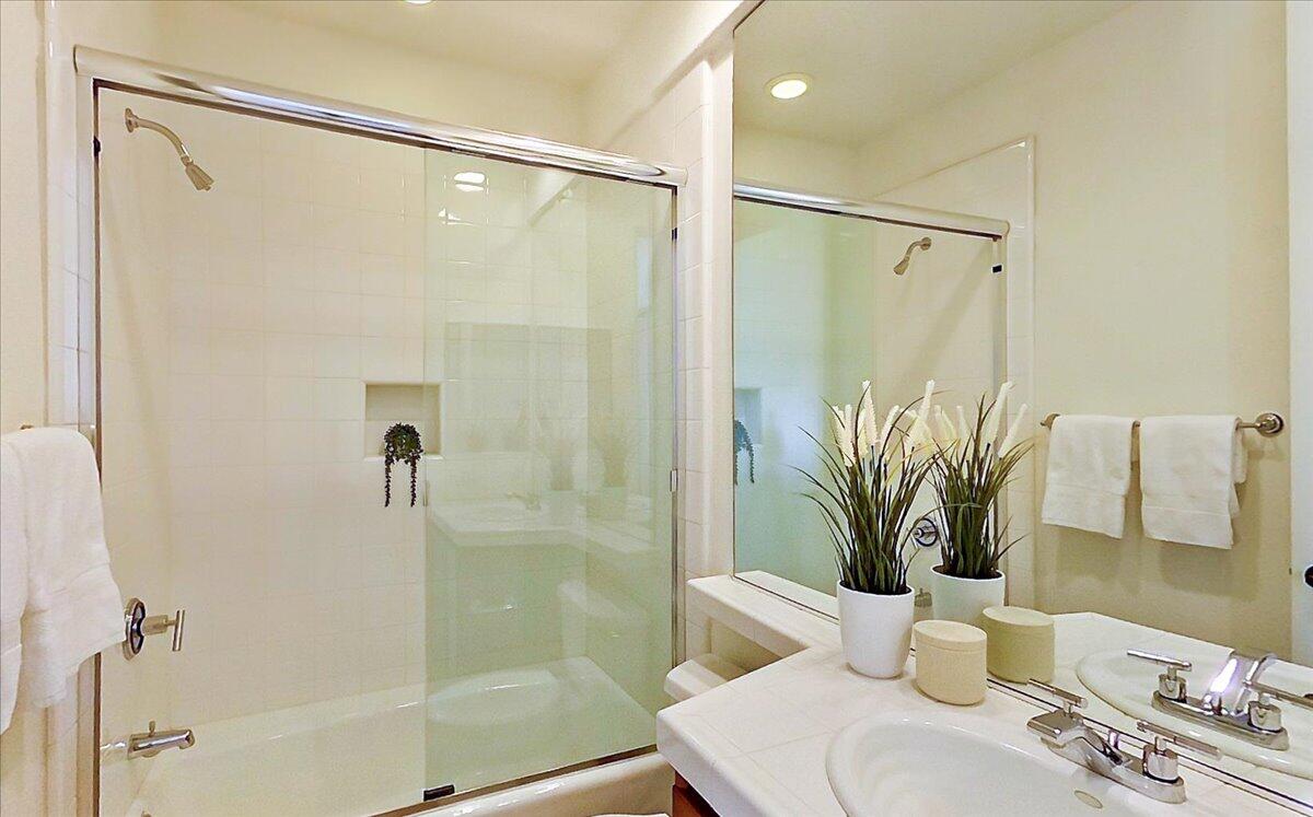 215 Loch Lomond Road Rancho Mirage, CA 92270 - Photo 30 of 57 a bathroom with a glass shower door