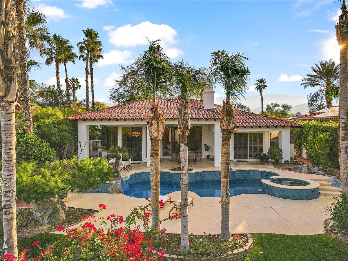 215 Loch Lomond Road Rancho Mirage, CA 92270 - Photo 40 of 57 a front view of a house with garden