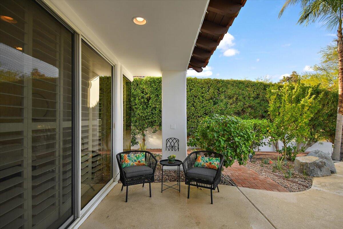215 Loch Lomond Road Rancho Mirage, CA 92270 - Photo 43 of 57 a balcony with furniture and a potted plant