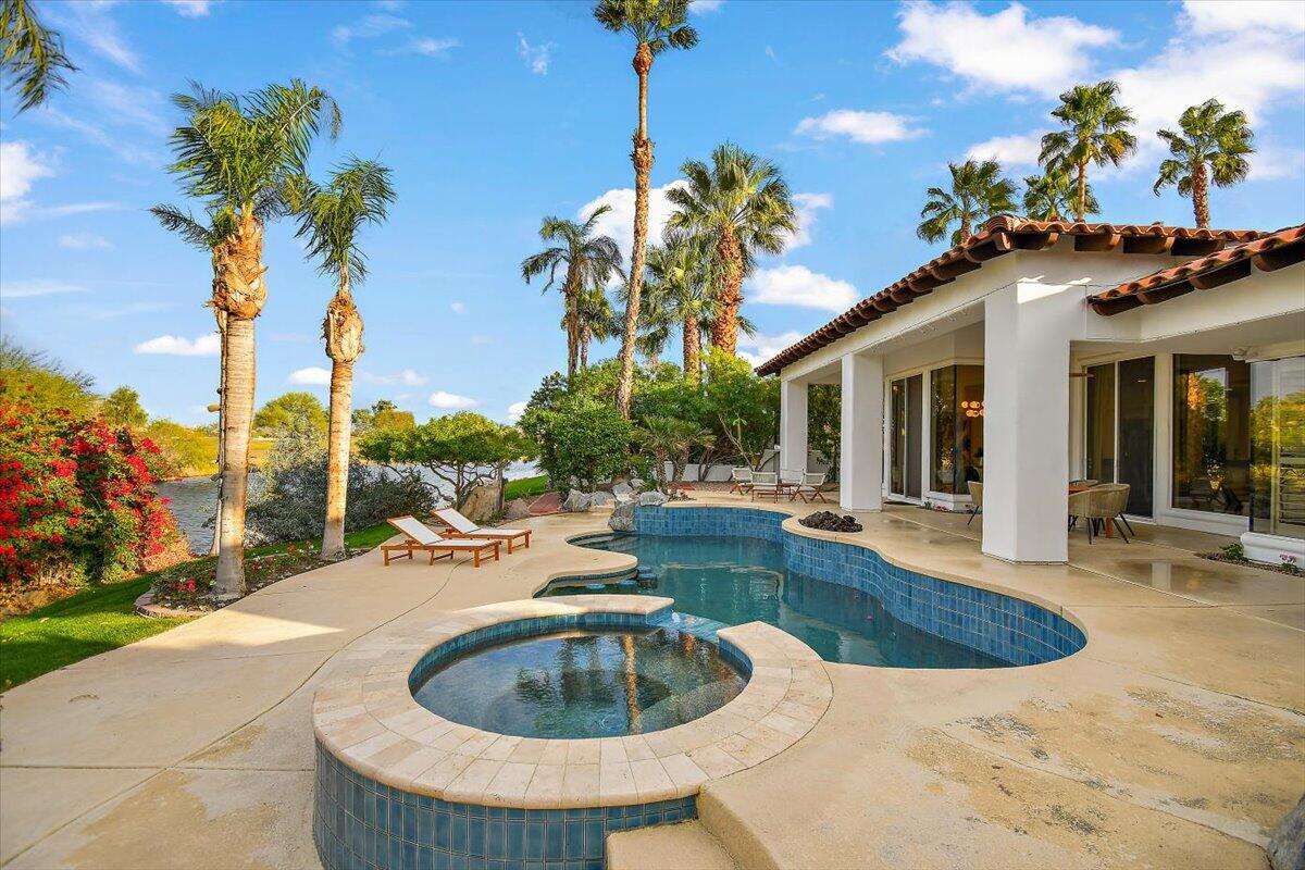215 Loch Lomond Road Rancho Mirage, CA 92270 - Photo 45 of 57 a view of a house with swimming pool and sitting area