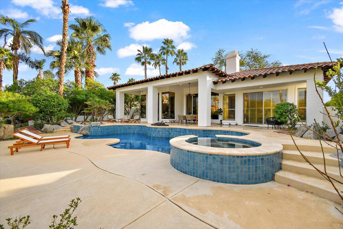 215 Loch Lomond Road Rancho Mirage, CA 92270 - Photo 46 of 57 a view of a house with swimming pool and sitting area