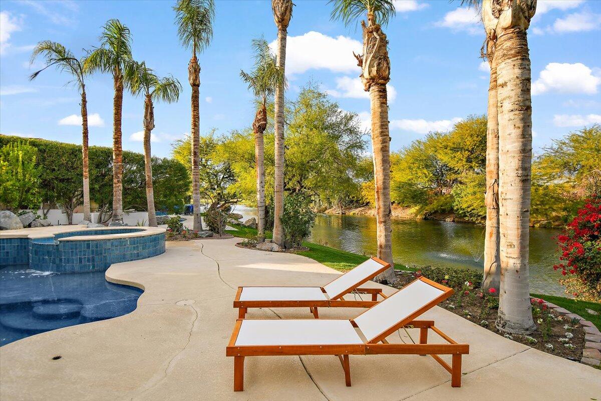 215 Loch Lomond Road Rancho Mirage, CA 92270 - Photo 47 of 57 a view of a swimming pool with a lounge chairs