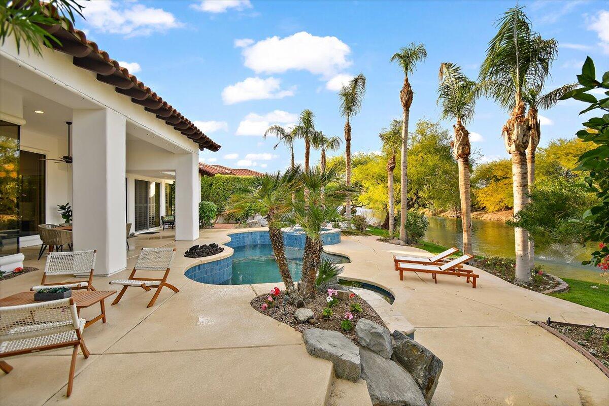 215 Loch Lomond Road Rancho Mirage, CA 92270 - Photo 48 of 57 a view of a patio with couches chairs and potted plants