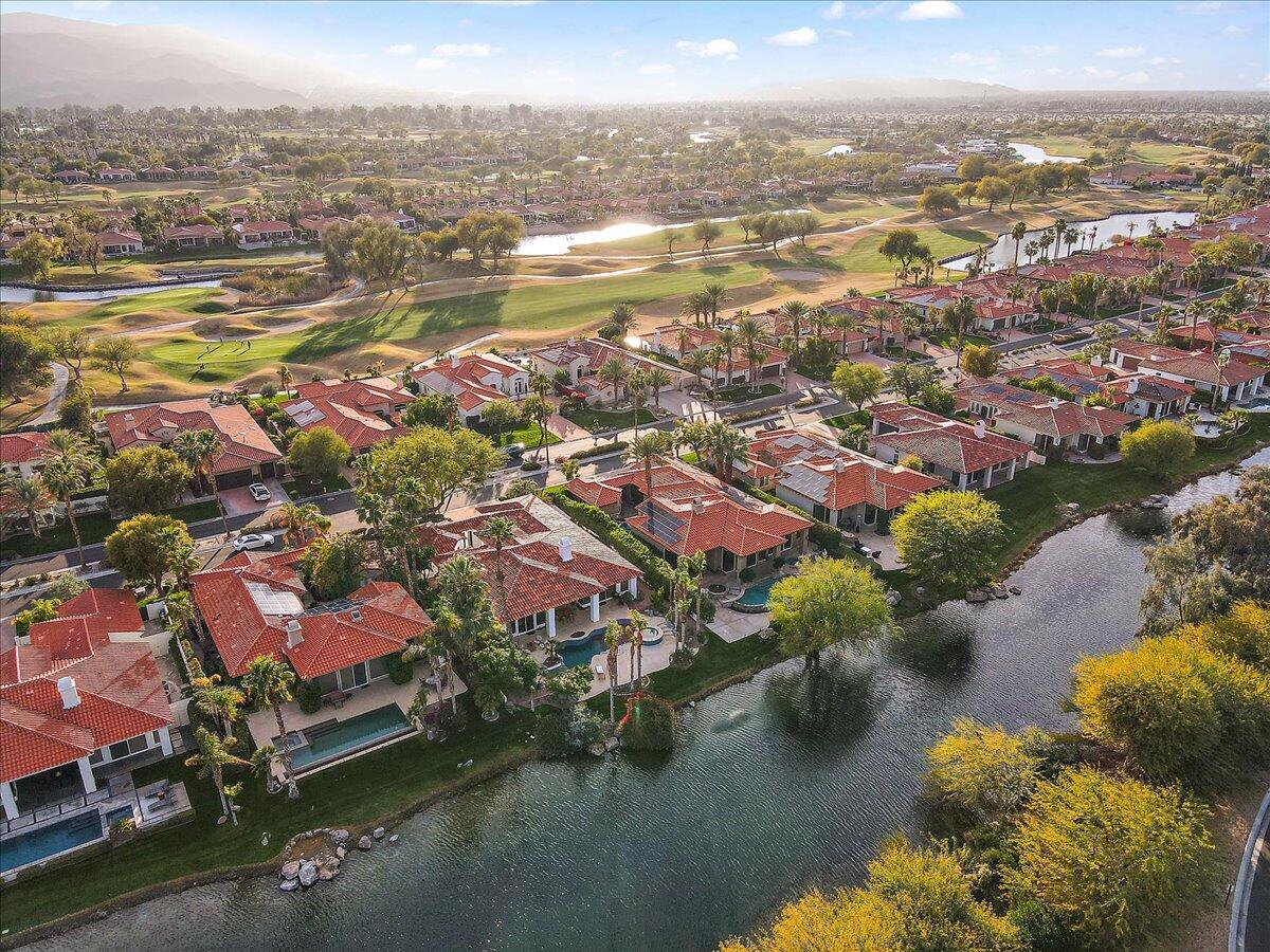 215 Loch Lomond Road Rancho Mirage, CA 92270 - Photo 52 of 57 an aerial view of residential houses with outdoor space and lake view