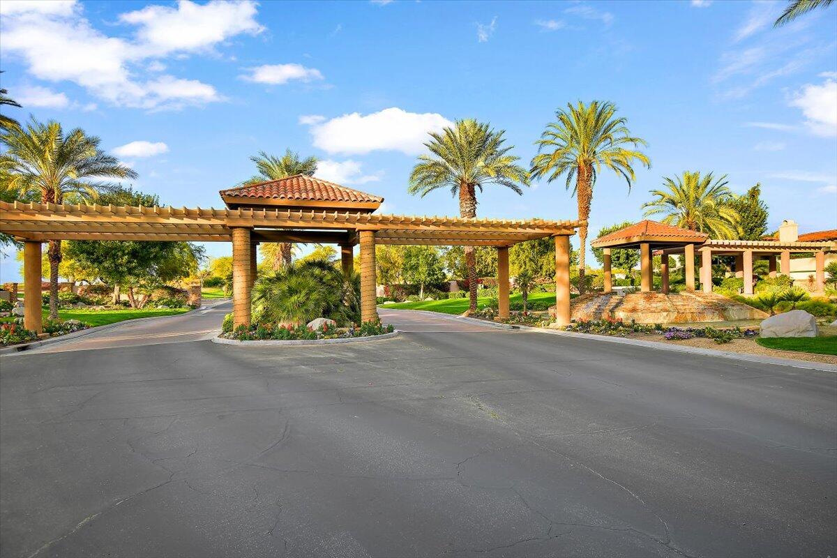 215 Loch Lomond Road Rancho Mirage, CA 92270 - Photo 54 of 57 a front view of a building with outdoor area