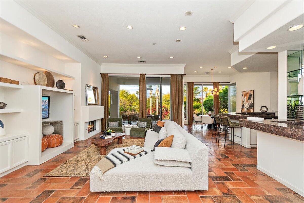 215 Loch Lomond Road Rancho Mirage, CA 92270 - Photo 6 of 57 a living room with fireplace furniture and a rug