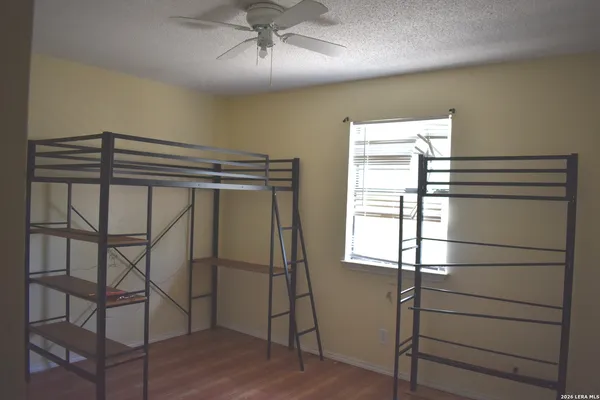 a view of a room with window and wooden floor