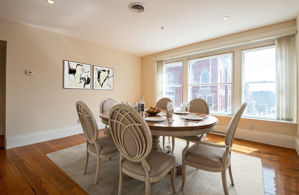 99 Washington Street, Unit 33 Salem, MA 01970 - Photo 21 of 36 a view of a dining room with furniture and wooden floor