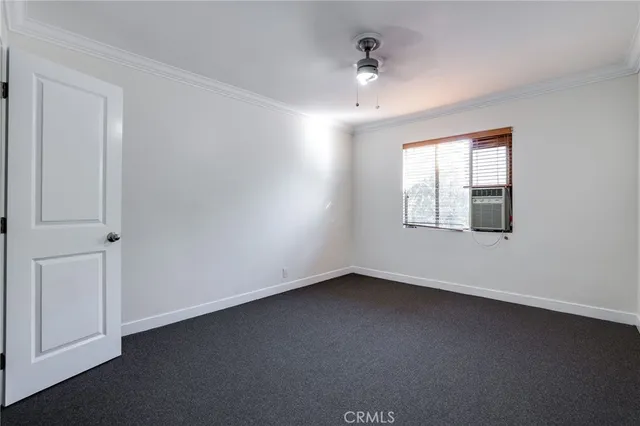 an empty room with a empty space and windows