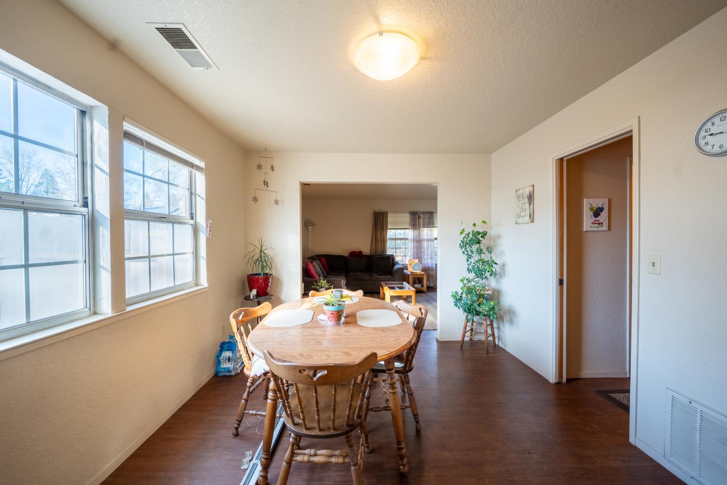 494 Surrey Court Murphys, CA 95247 - Photo 66 of 76 a view of a dining room with furniture window and wooden floor