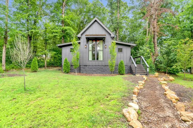 a front view of a house with garden