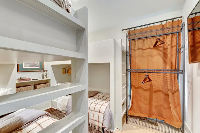 a bedroom with a bed and a walk in closet