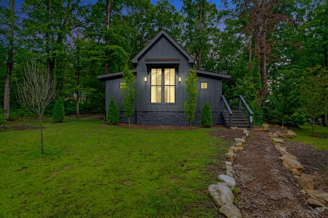 a front view of a house with garden
