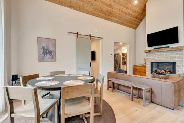 a dining room with furniture and window