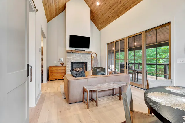 a living room with furniture fireplace and flat screen tv
