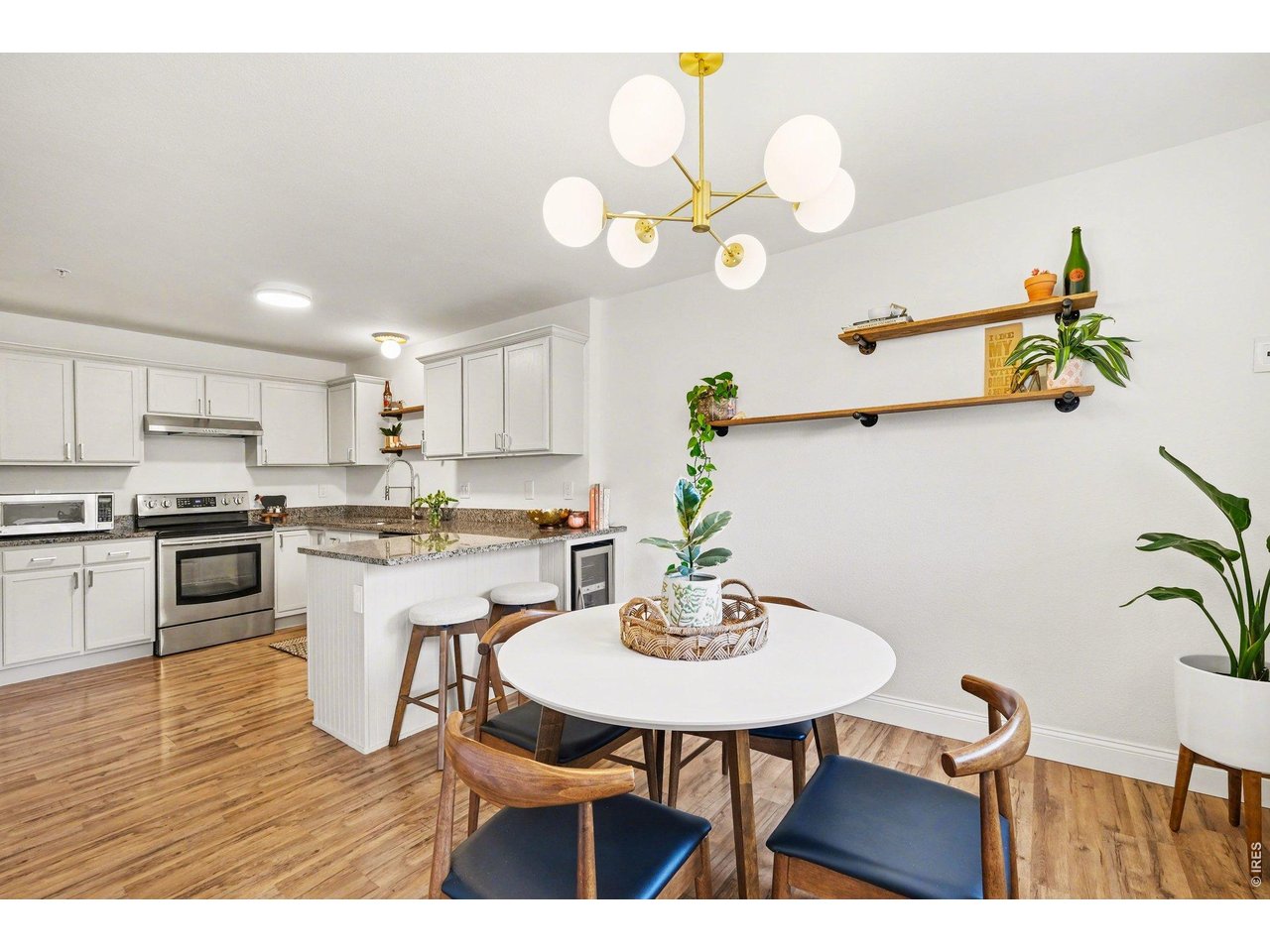 2702 Rigden Parkway, Unit 1 Fort Collins, CO 80525 - Photo 13 of 31 a kitchen with a table and chairs in it