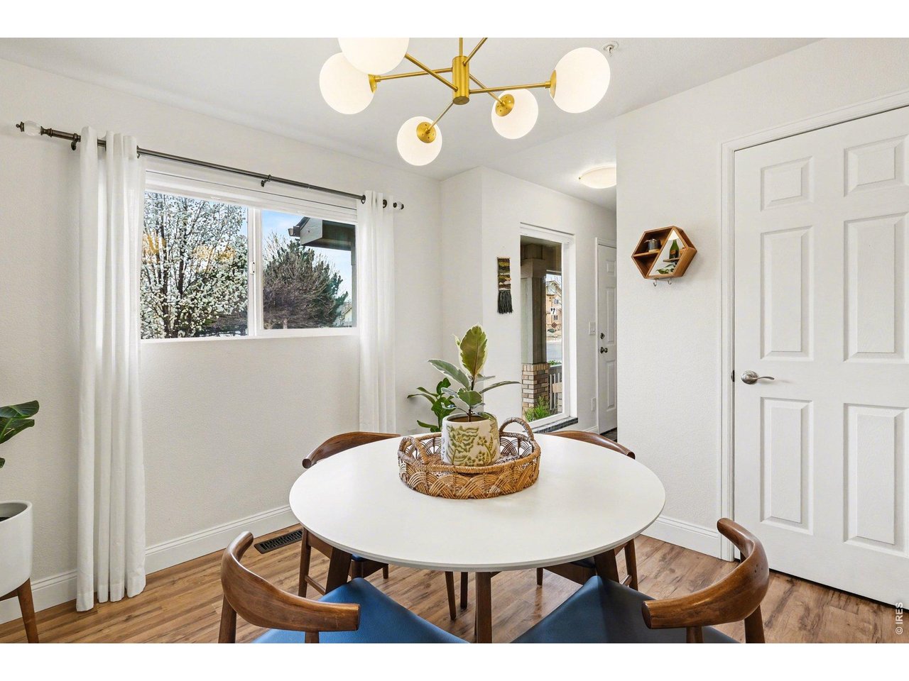 2702 Rigden Parkway, Unit 1 Fort Collins, CO 80525 - Photo 14 of 31 a view of a dining room with furniture and chandelier