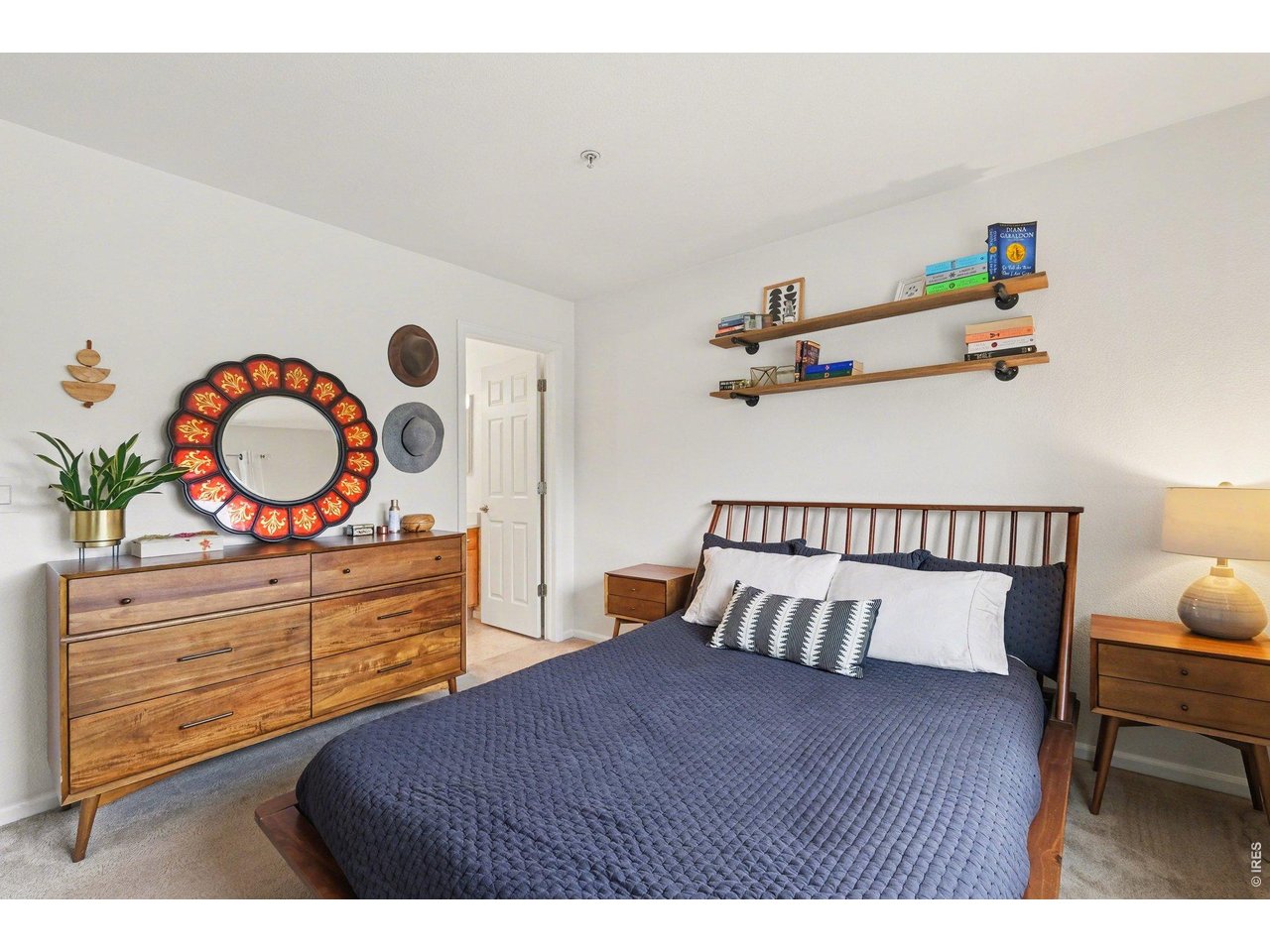 2702 Rigden Parkway, Unit 1 Fort Collins, CO 80525 - Photo 16 of 31 a bedroom with a bed and cabinets