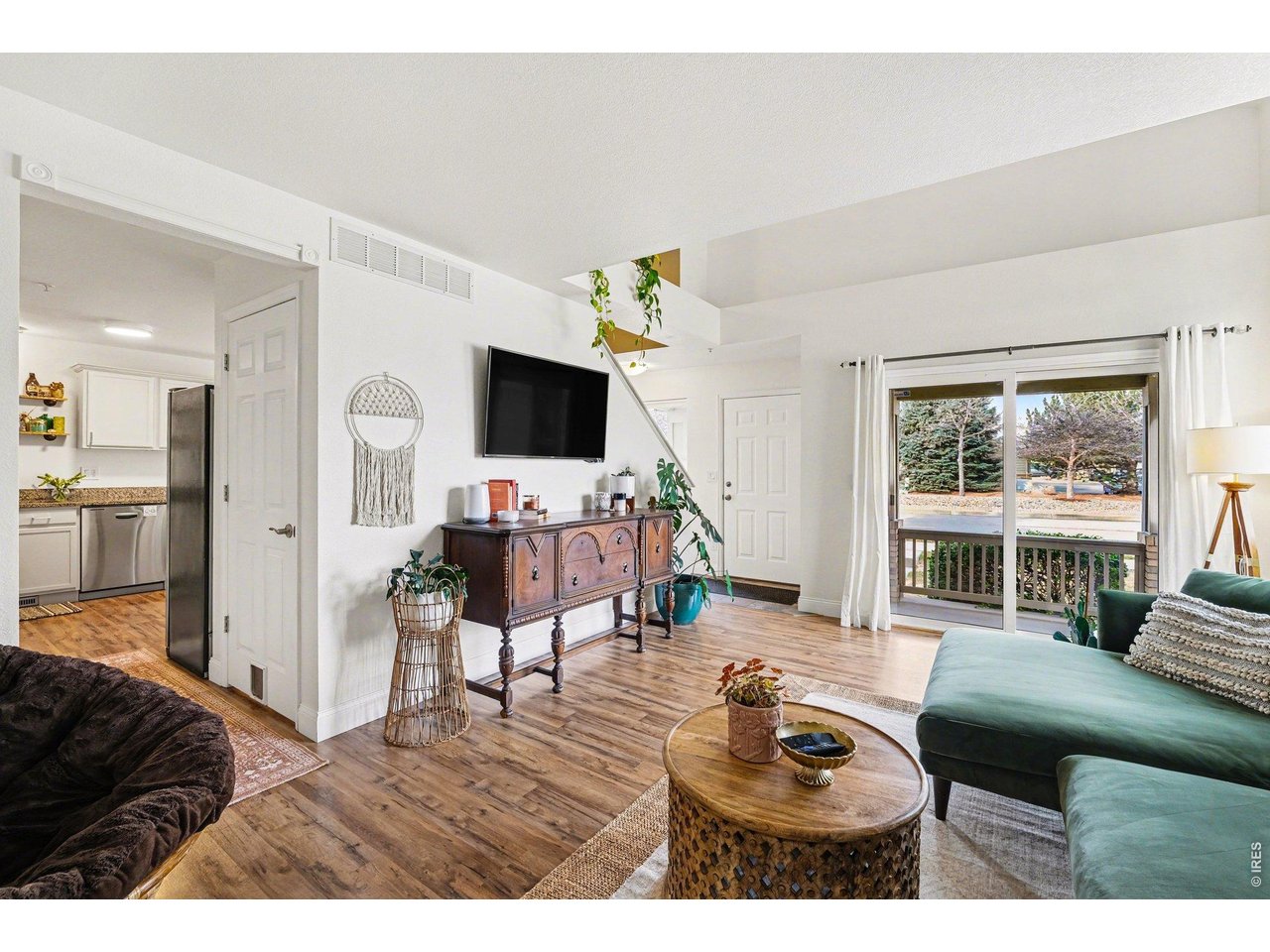 2702 Rigden Parkway, Unit 1 Fort Collins, CO 80525 - Photo 8 of 31 a living room with furniture and a flat screen tv