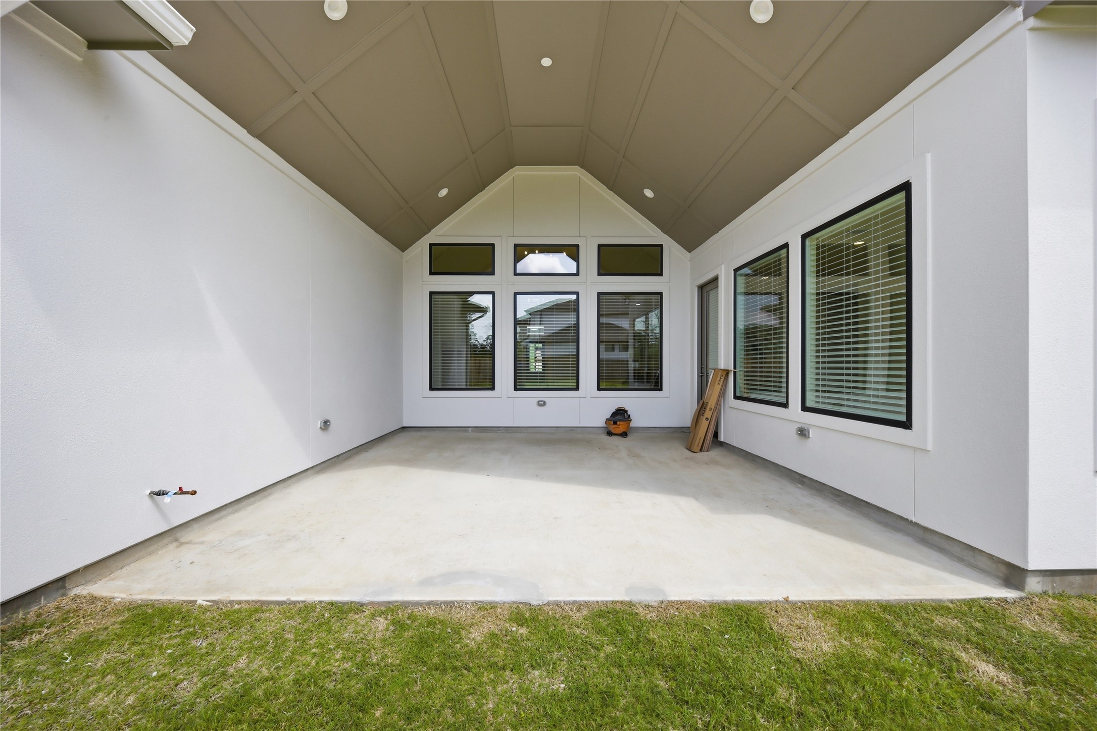 416 Venado View Court Conroe, TX 77304 - Photo 28 of 34 Large covered outdoor living area featuring vaulted ceilings