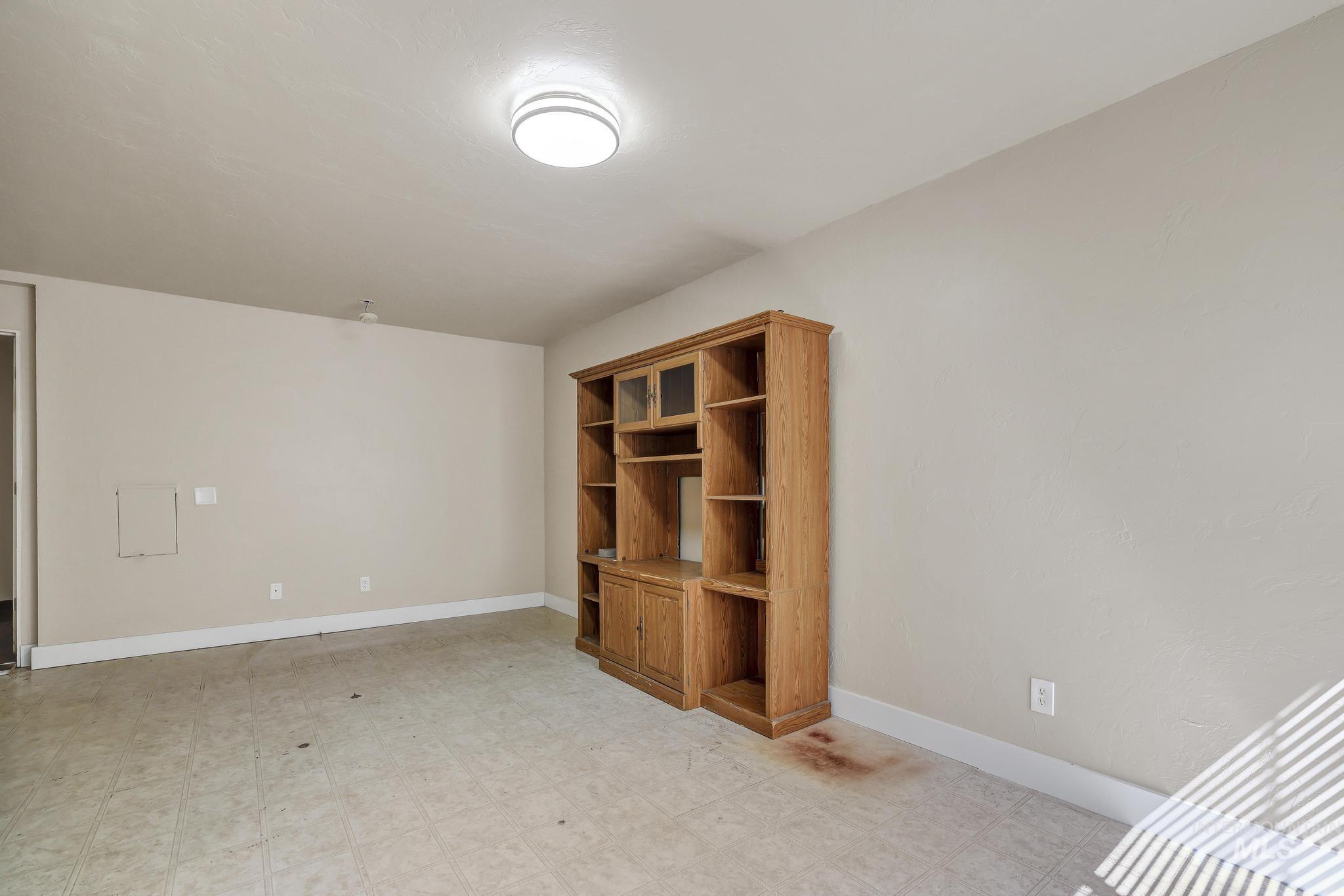 322 Jackson Street Twin Falls, ID 83301 - Photo 18 of 47 Recessed built-in cabinetry with glass-front display cabinets, open shelving, and base storage