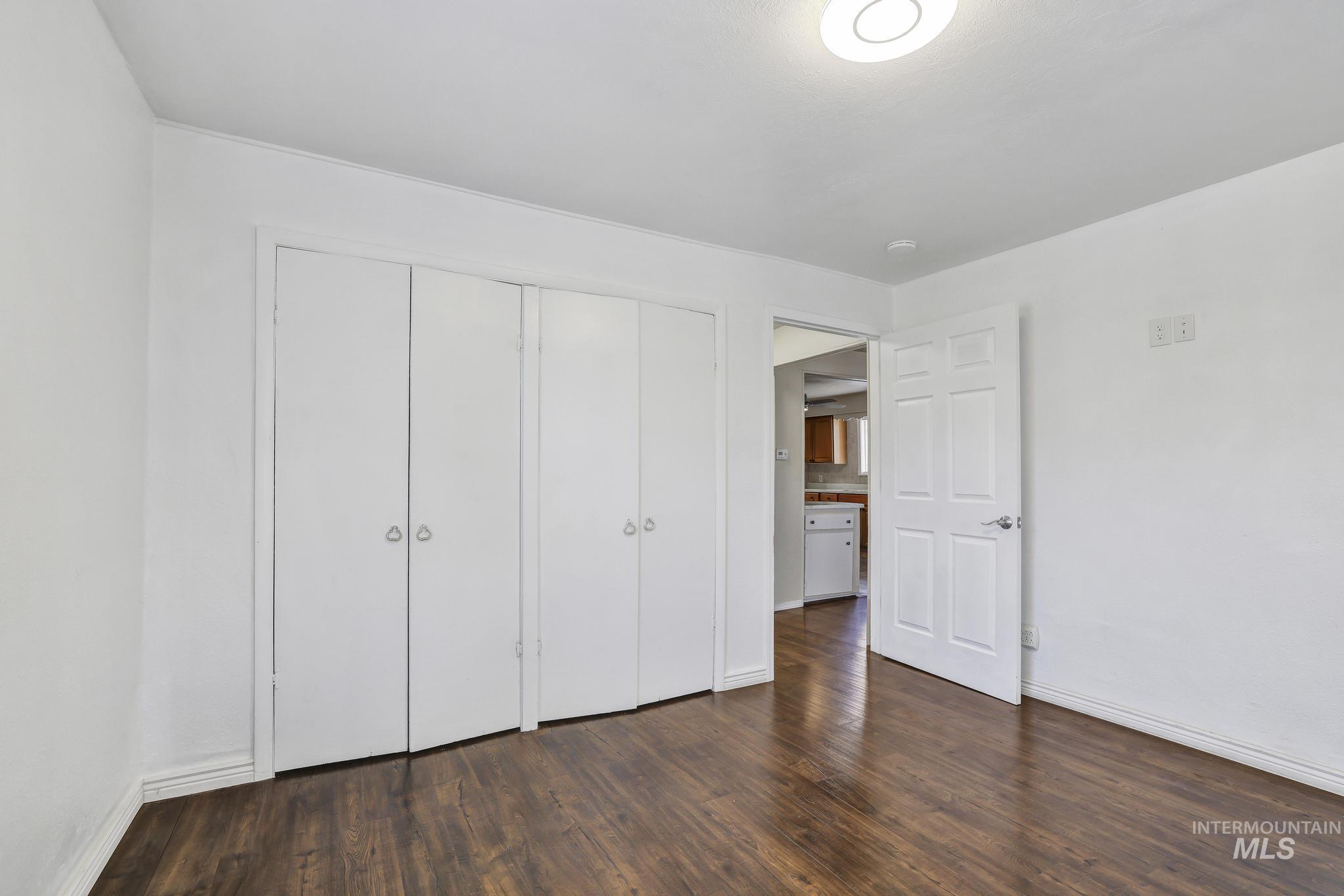 322 Jackson Street Twin Falls, ID 83301 - Photo 21 of 47 Interior room featuring wood-finish flooring and white walls