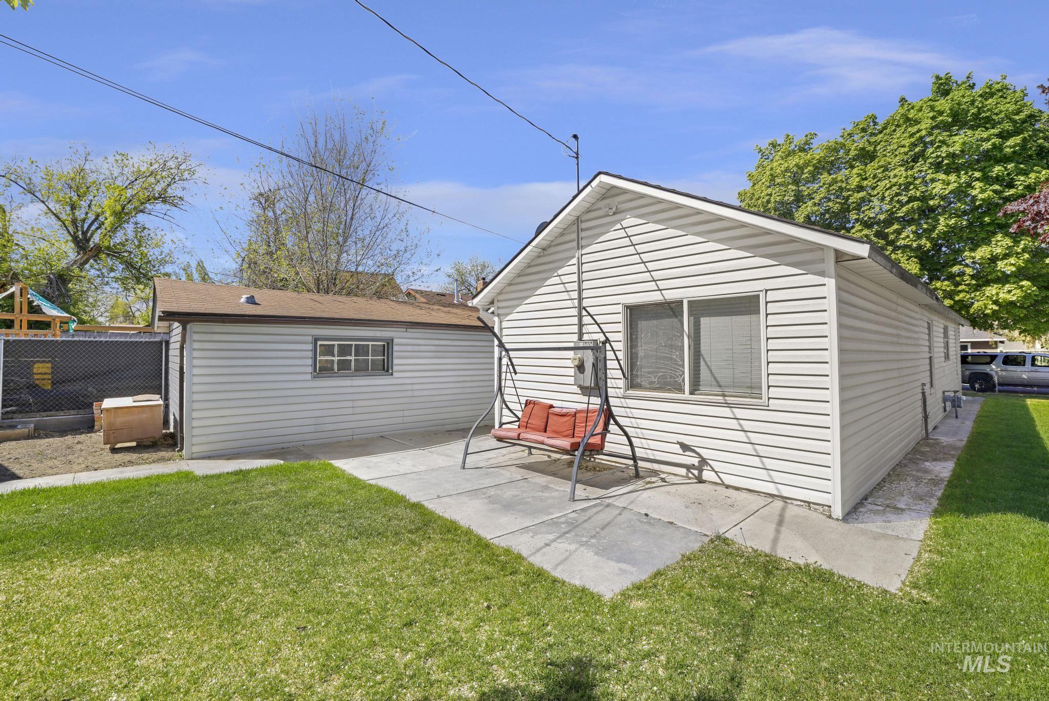 322 Jackson Street Twin Falls, ID 83301 - Photo 30 of 47 Rear exterior featuring white horizontal siding and a concrete patio