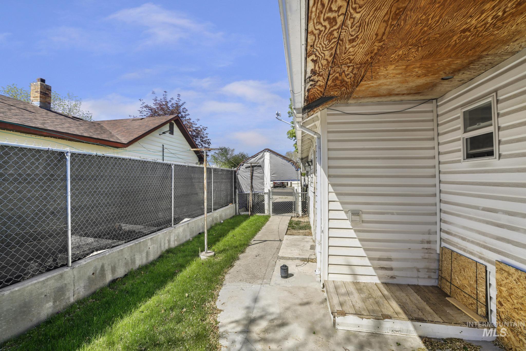 322 Jackson Street Twin Falls, ID 83301 - Photo 31 of 47 Concrete pathway extending along the property