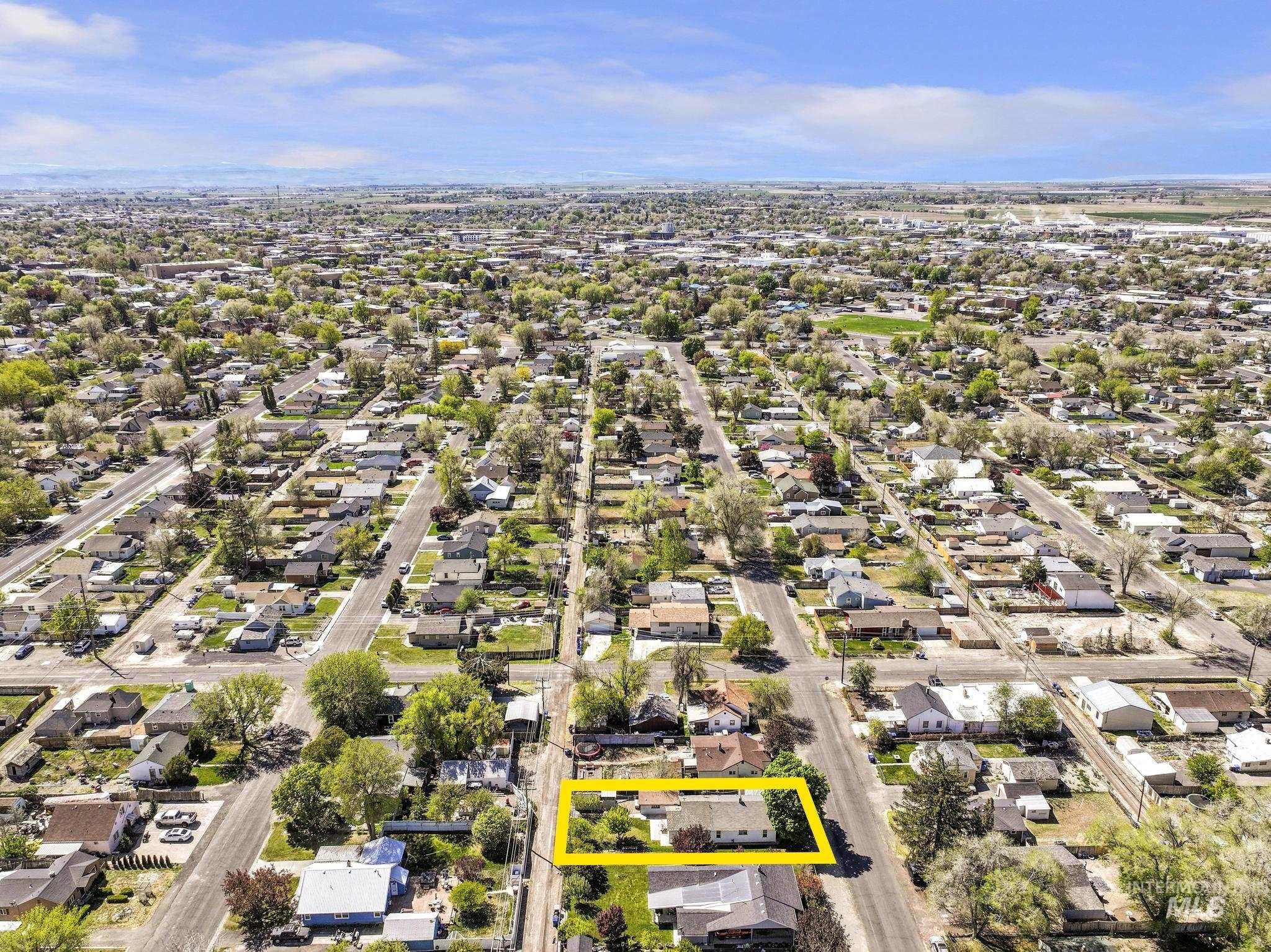 322 Jackson Street Twin Falls, ID 83301 - Photo 43 of 47 Aerial perspective of a residential neighborhood featuring tree-lined streets and a clear blue sky