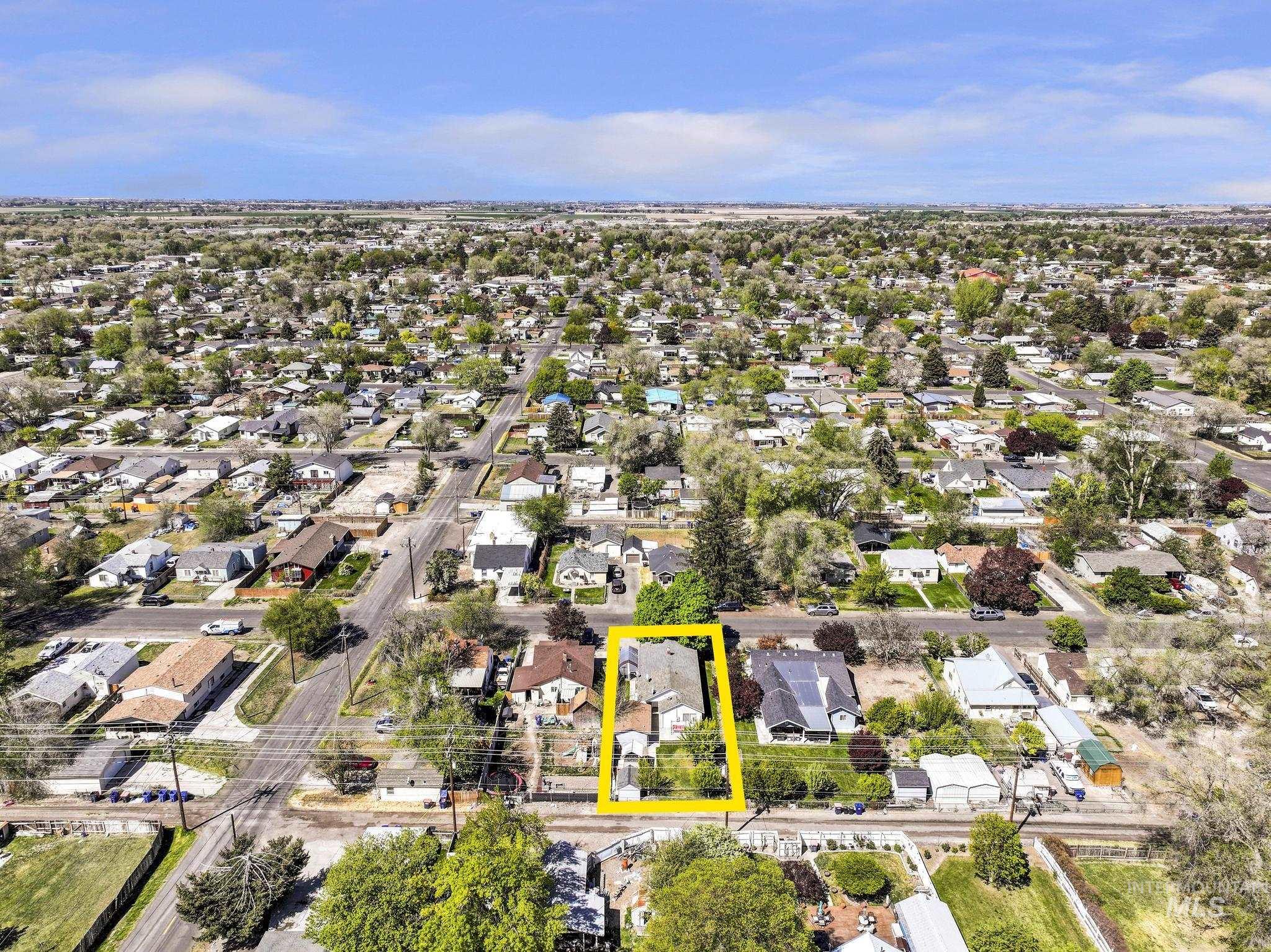 322 Jackson Street Twin Falls, ID 83301 - Photo 44 of 47 Aerial perspective highlighting a residential property with a multi-story structure and surrounding green space