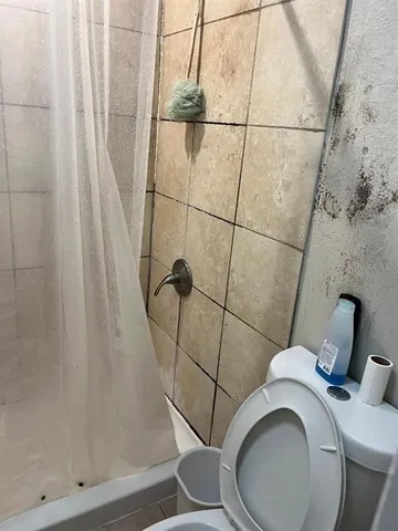 a view of cabinets a sink and dishwasher in a kitchen
