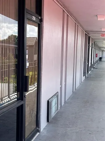 a view of a hallway with windows