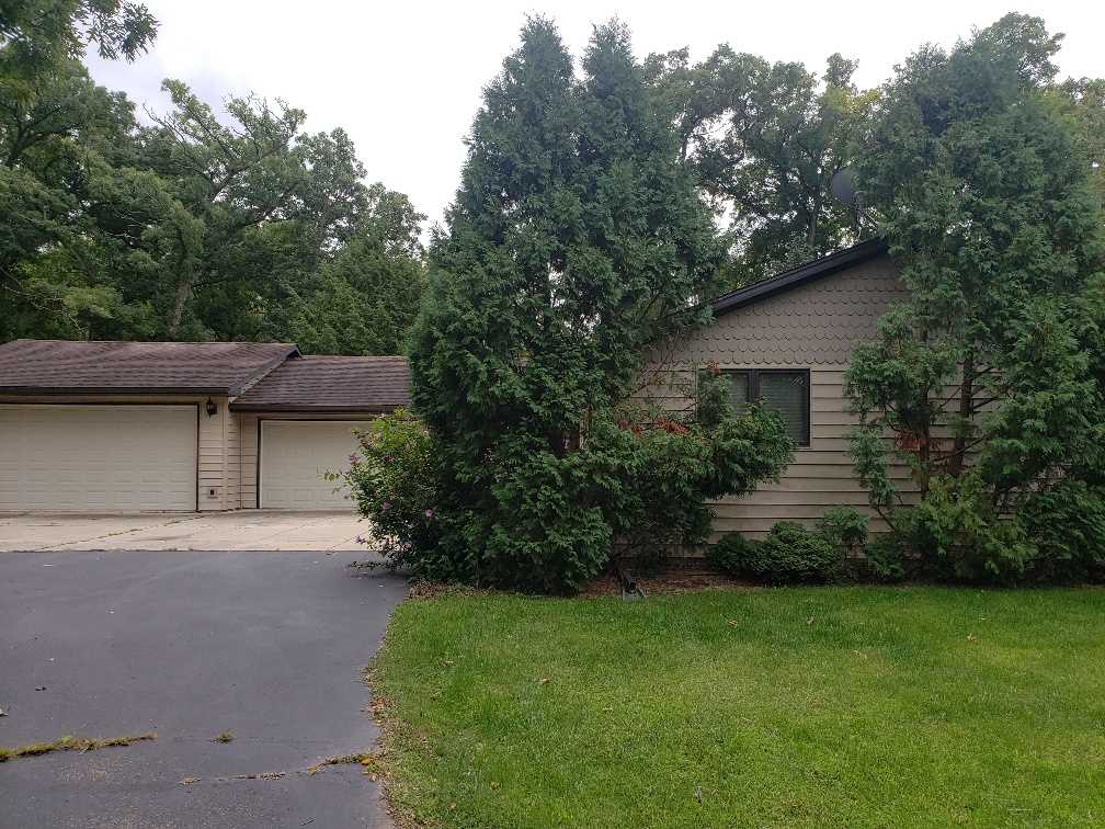 1493 North River Road Oregon, IL 61061 - Photo 1 of 9 a view of a back yard of the house