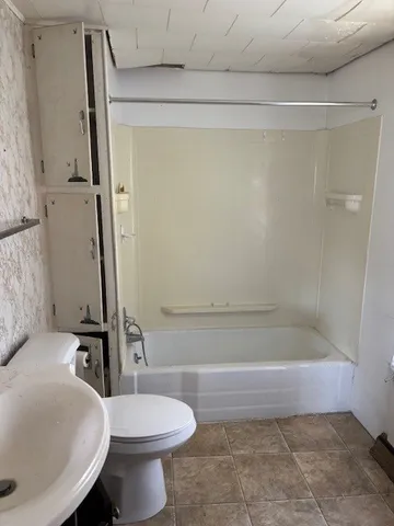 a view of an entryway with wooden floor and door