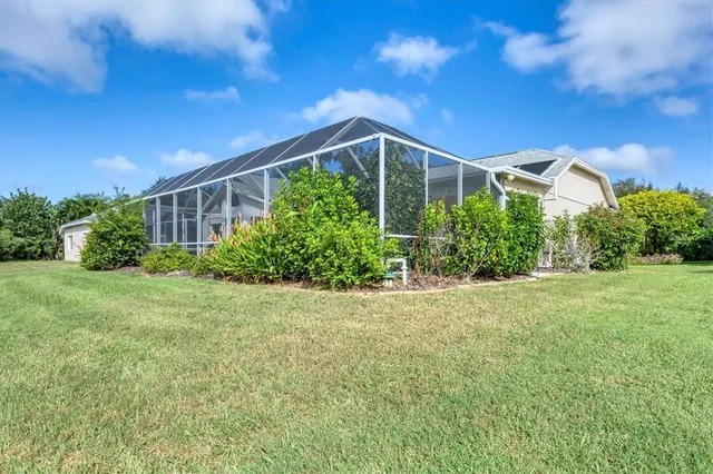 a view of a house with backyard and garden