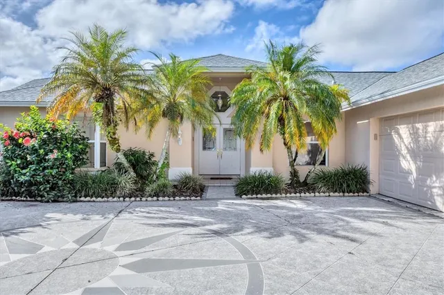 a front view of multi story residential apartment building with yard and green space