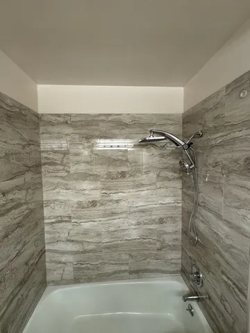 a view of a swimming pool with outdoor seating