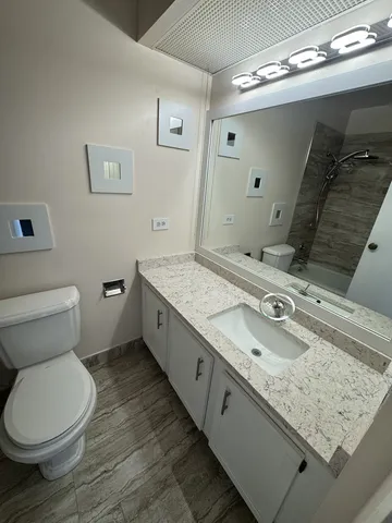 an aerial view of a houses with outdoor space and trees