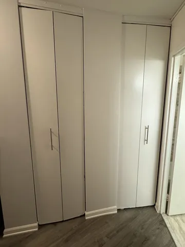 a lobby with a couch and glass door