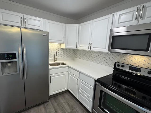 a view of a garage with cars