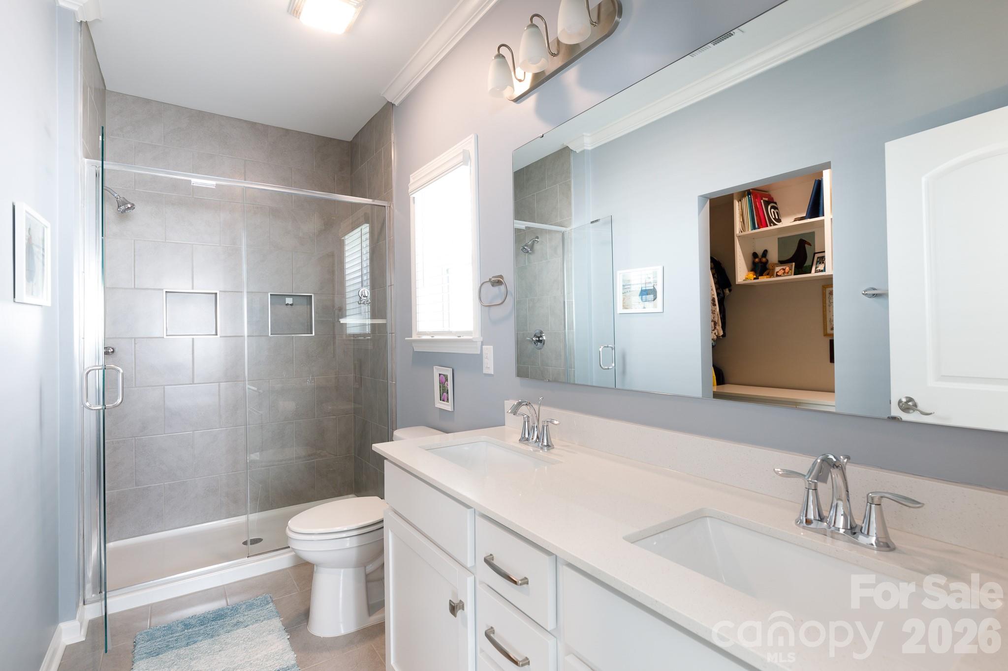 40308 Crooked Stick Lane Lancaster, SC 29720 - Photo 23 of 46 a bathroom with a sink and a mirror