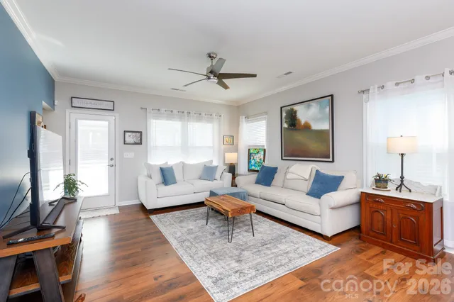 a living room with furniture and a flat screen tv