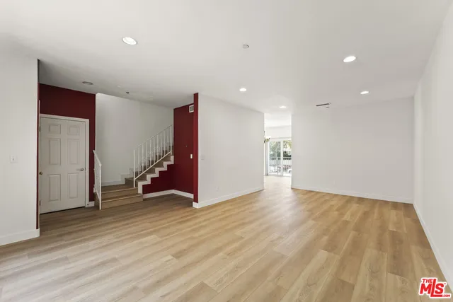 a view of a livingroom with wooden floor