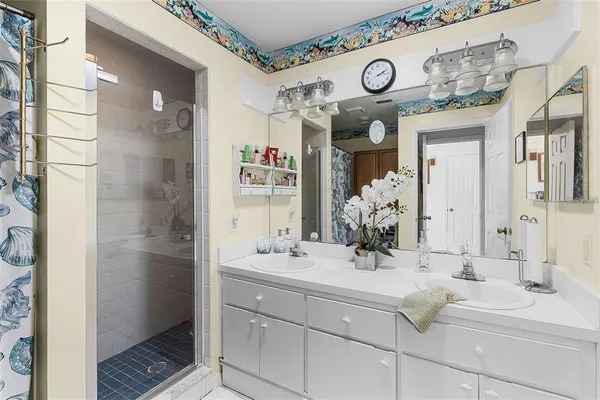 a bathroom with a sink and a mirror